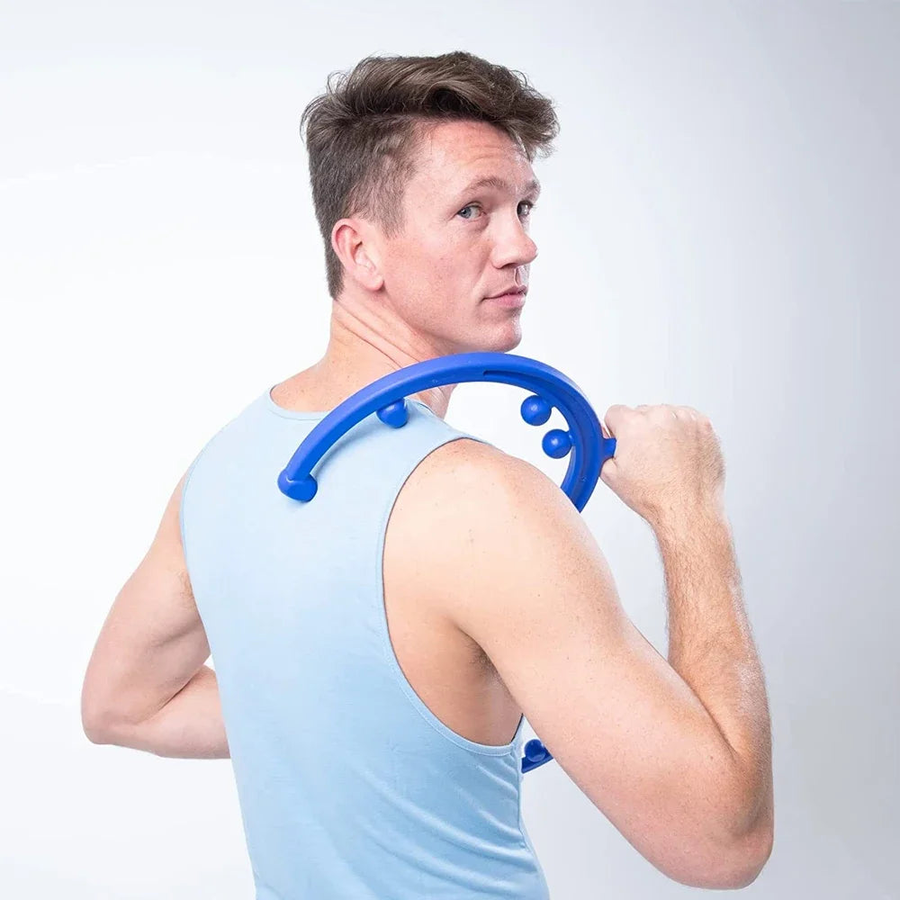 Blue handheld massage cane positioned on the upper back