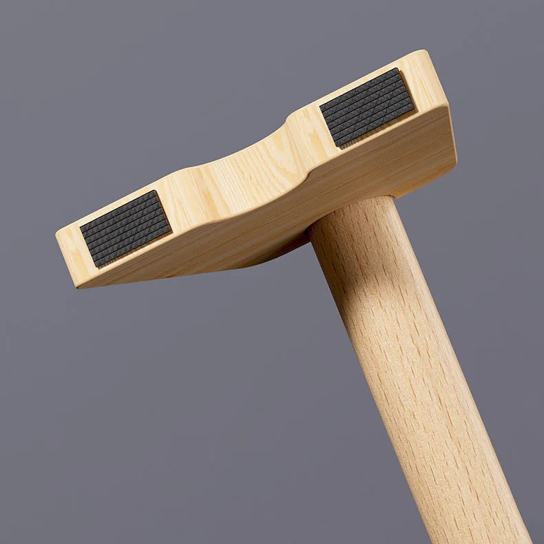 Wooden parallettes bar with black grip pad and arched wooden base for floor exercises