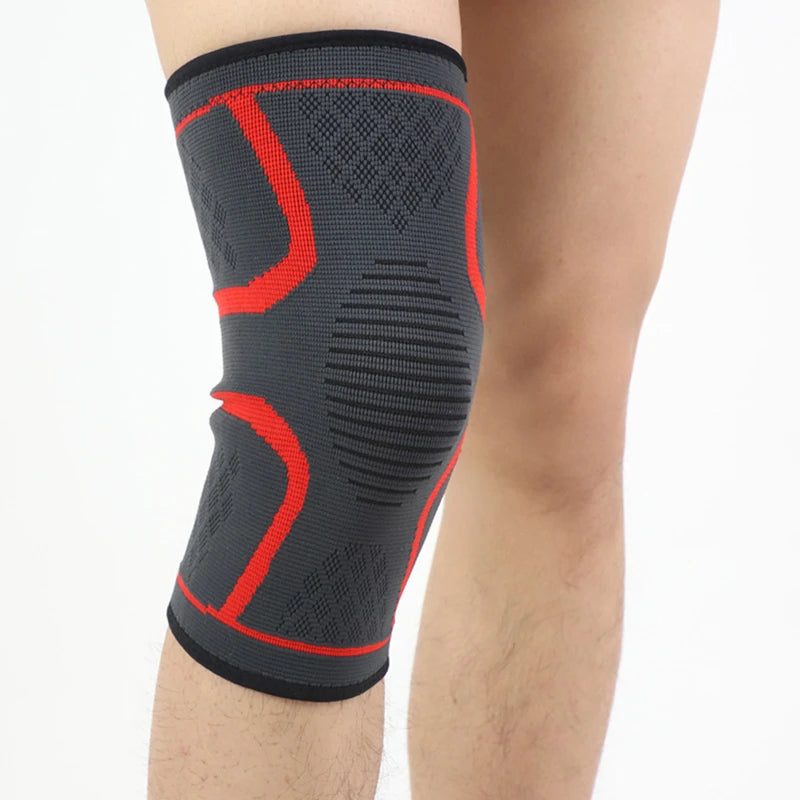 Black knee sleeve with red zigzag support lines and ribbed side texture.