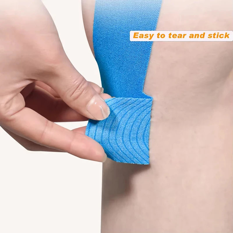 Hand applying blue kinesiology tape strip on knee using adhesive backing