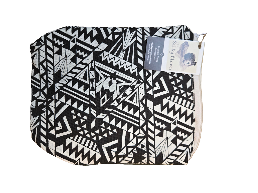Handmade cloth gear bag with black-and-white geometric pattern and fabric handle tab